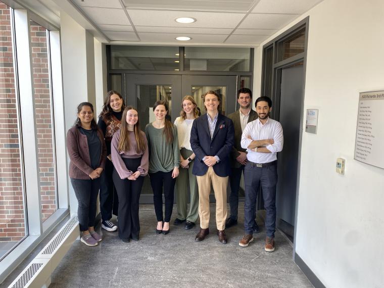 The participants of the U of G CEPS 3MT® competition pose and smile for a picture in a hallway of Reynolds building.