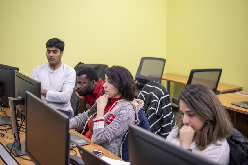 Image of MCTI students in class on computers