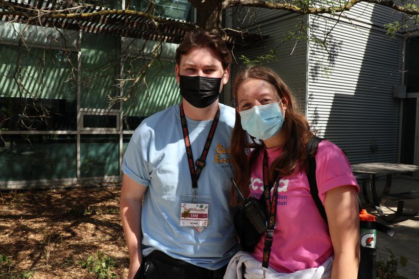 Sam Weeks and Rachel Tait with masks on outside.