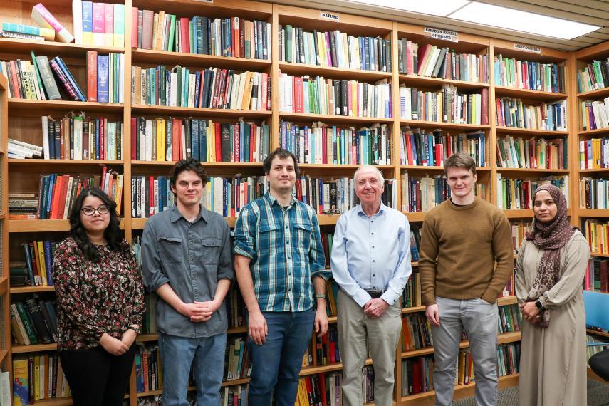Dr. William Smith stands with five members of the W.R. Smith Research Group in MacNaughton building.