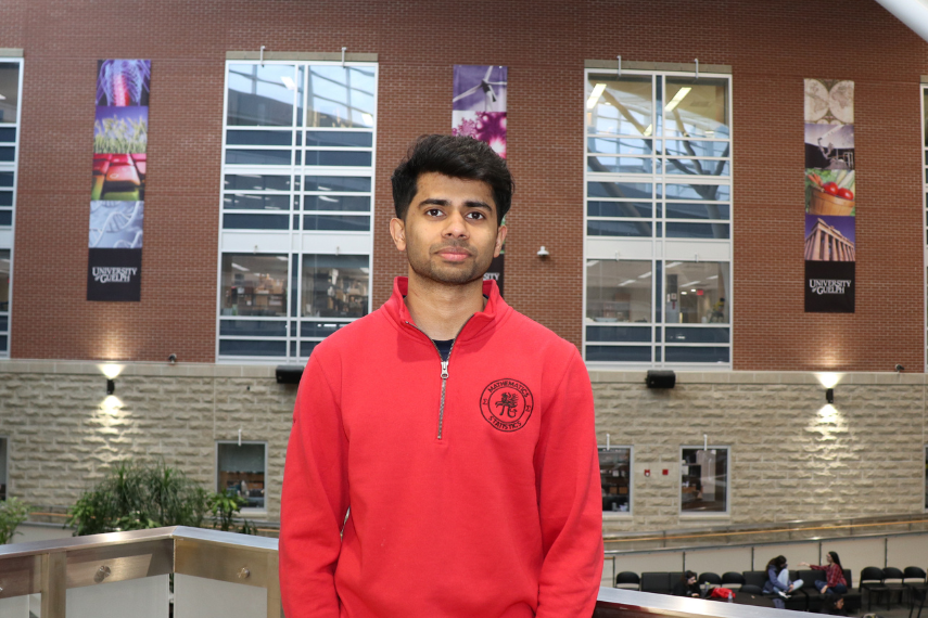 Headshot of Vinay Joshy with SSC Atrium in background. 