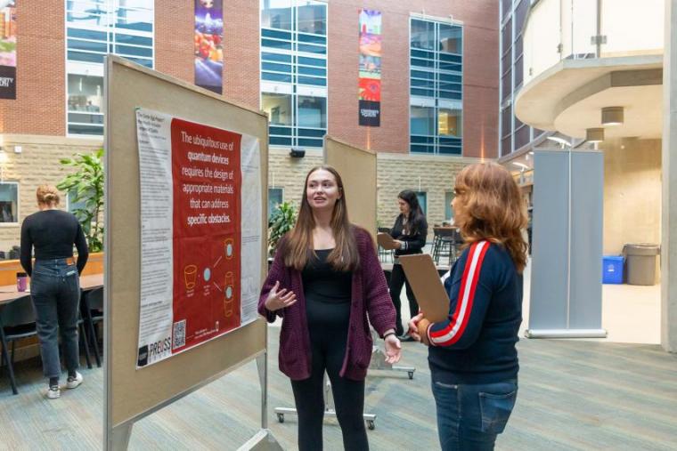 Candice Robillard chats with associate dean of research, Dr. Monica Cojocaru, at the poster competition