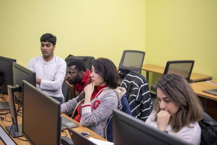 Image of MCTI students in class on computers
