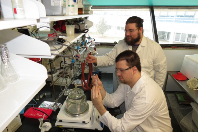 Dr. Jeffrey Davidson and Charles Gauthier-Signore working in the Auzanneau Lab.