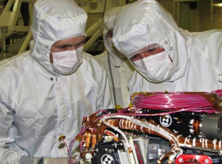 Ralf Gellert, from left, preparing to install the APXS sensor head at NASA's Jet Propulsion Laboratory.NASA/JPL-Caltech