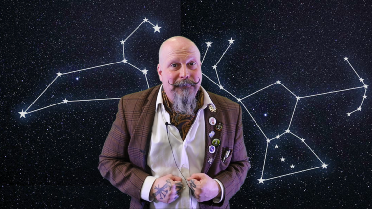 Orbax Thomas in a scene from one of the stargazing guide videos. In the background there is an outline of a constellation.
