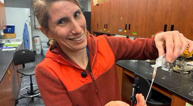 Dr. Erica Pensini holding up the slime.