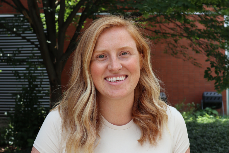 Headshot of Kristina Kupferschmidt outdoors. 