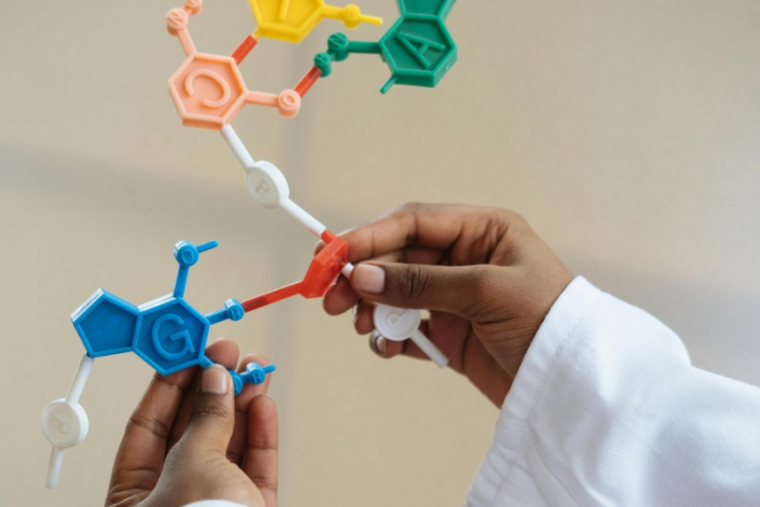 Young childs hands playing with plastic molecules. 