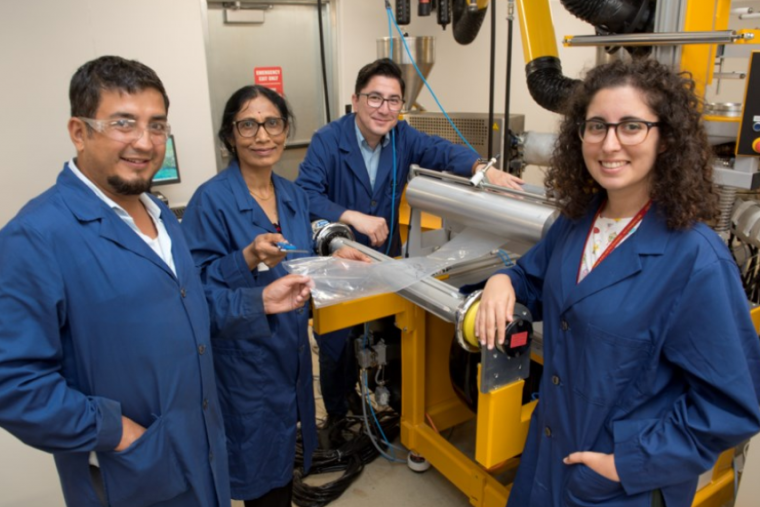 Group of researchers in lab. 