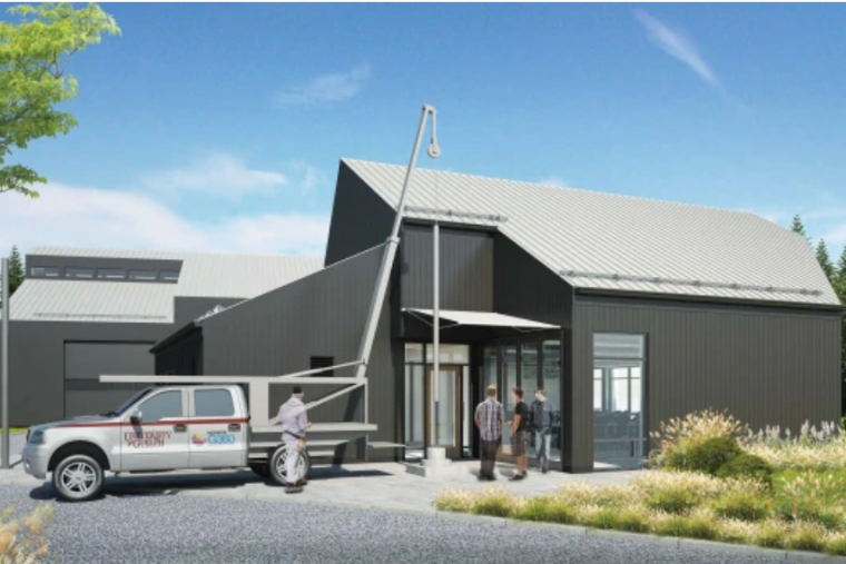 Image of Morwick Groundwater Research Centre, with a truck in front and two people. 