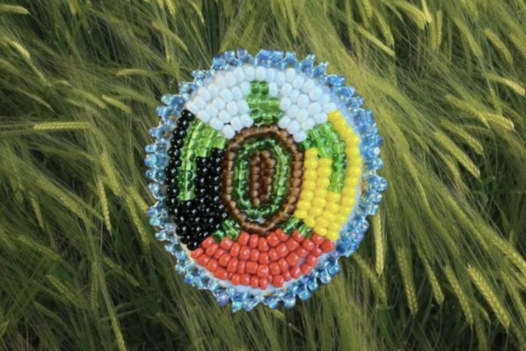 Maja Wetzl. “Flat-stitch beaded turtle on medicine wheel.” Beads on felt with deer hide backing, 2023.