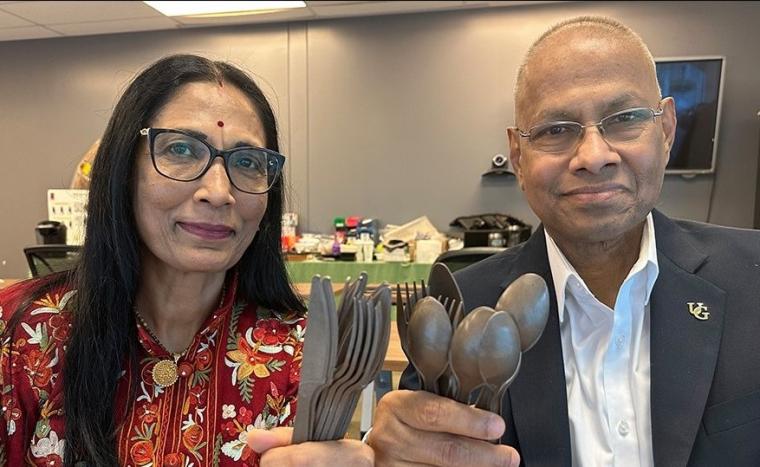 Dr. Amar Mohanty (right) and Dr. Manjusri Misra (left) hold up their bio-friendly cutlery