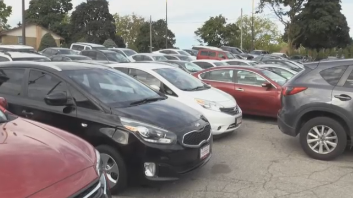 A photo of multiple parked cars.