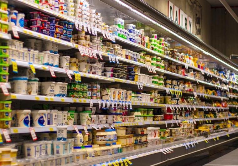 Grocery store aisle with stocked shelves