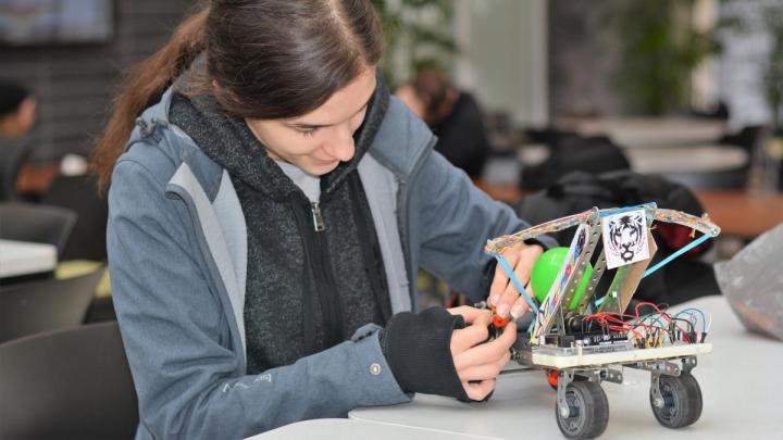 Female engineering student working on her Teddy Bear Wheelchair