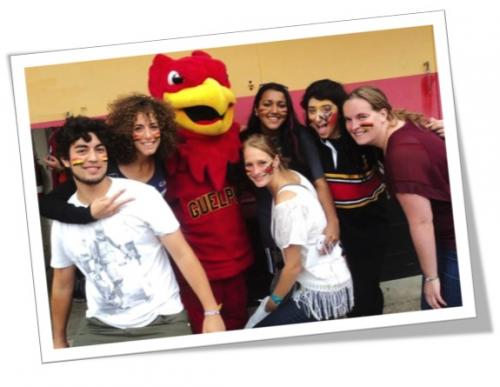 Image of students with Guelph Mascot