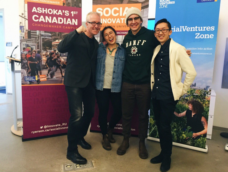 Image of 4 people. Left to right: unidentified man, Monique Chan - 4th year Arts & Sciences student, Ryan Schott - 4th year Software Engineering student, and another unidentified man at the Ryerson Social xChange event. 