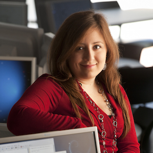 Woman leaning on computer