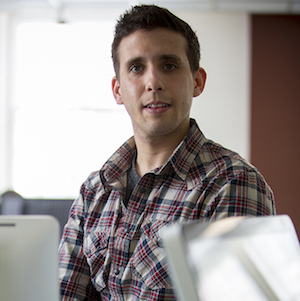 Man standing at computer