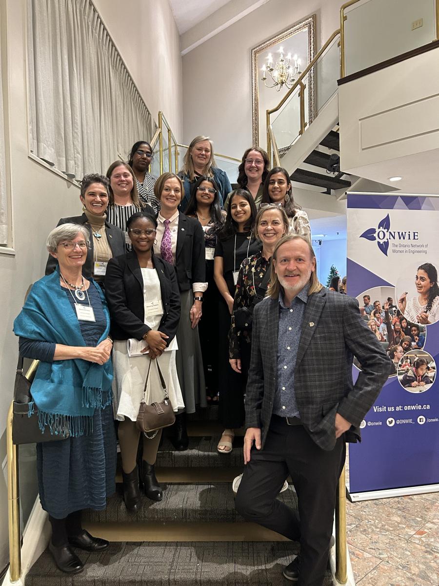 Image of UofG faculty at the ONWiE Summit 2023 conference on stairs.