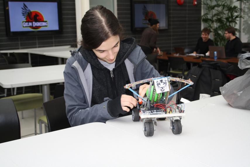 student working on a teddy bear wheelchair