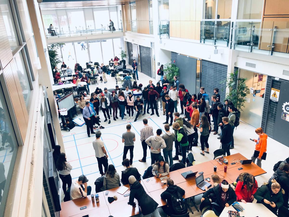 Adams Atrium view from above, filled with students competing in a design challenge