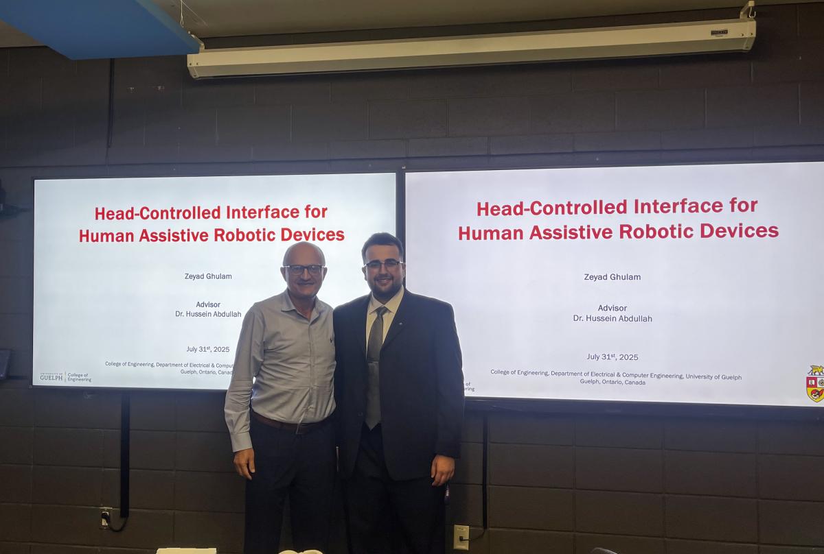 Dr. Hussein A. Abdullah, left, and Zeyad Ghulam present their research.