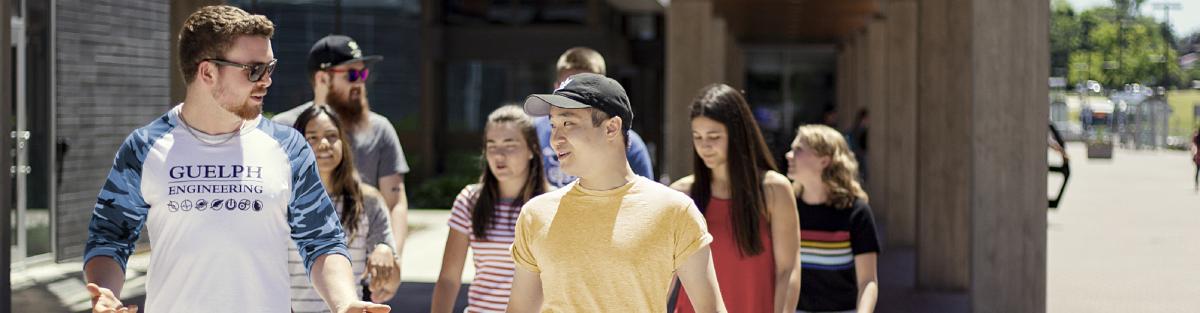 students walking in a group toward the camera