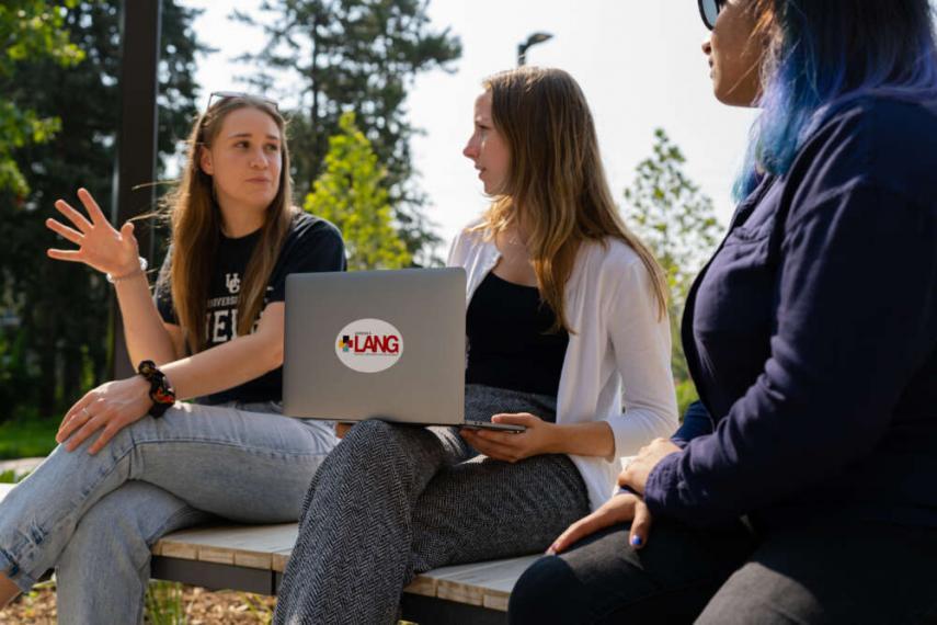 Lang students sitting in the plaza