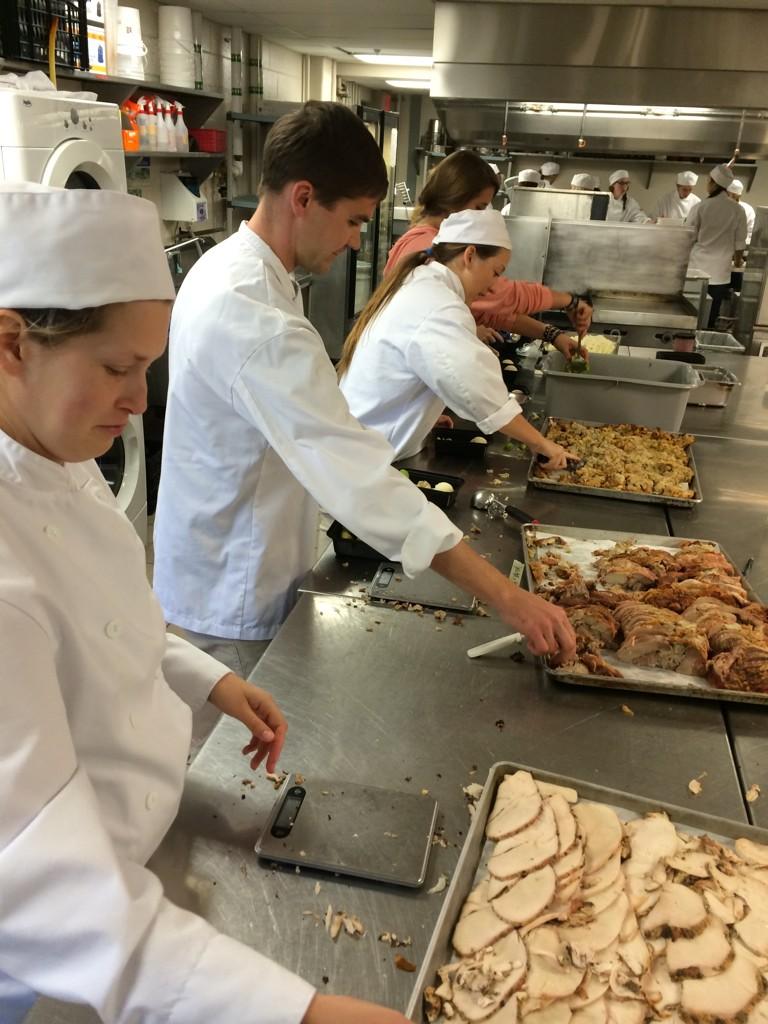 Student volunteers preparing Thanksgiving dinners in PJ's Restaurant