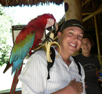 Photo of Justin Taillon with a Parrot 