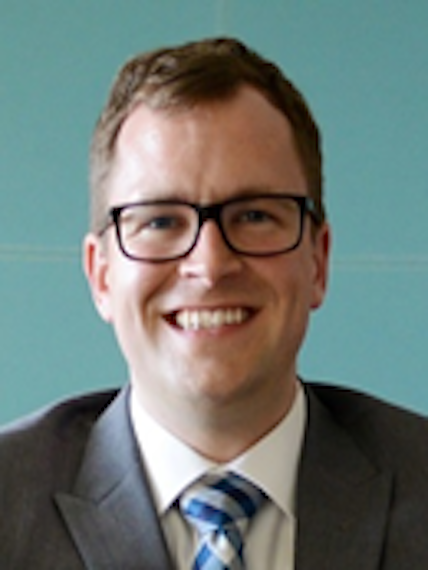 A photograph of Dr. Geoffrey A. Power.