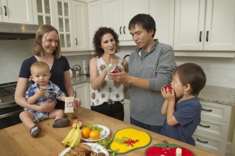 A photograph of a family examining nutritious food