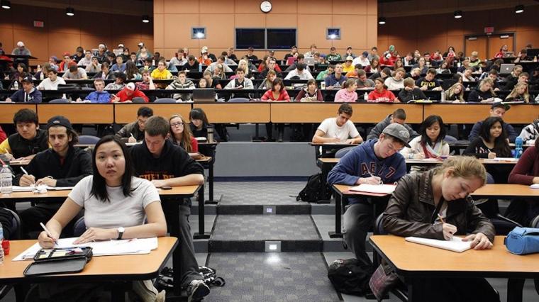 A photograph of a students in a lecture hall