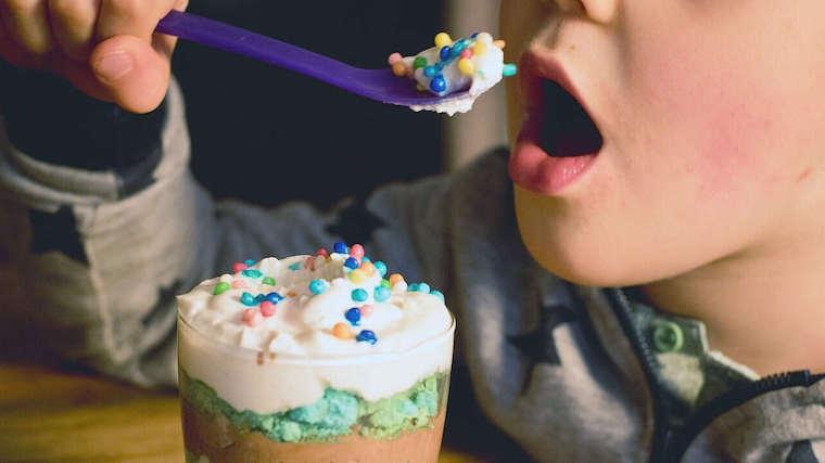 A photograph of a child eating ice cream.