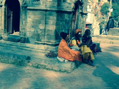 Holy Men sitting at a religious site in Nepal