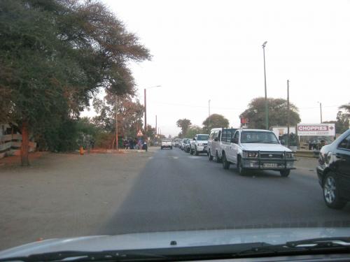 Photo from front seat of car, oncoming traffic filled with cars