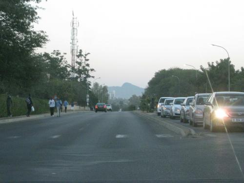 Photo taken from front seat of the car, large four lane highway with not a lot of traffic