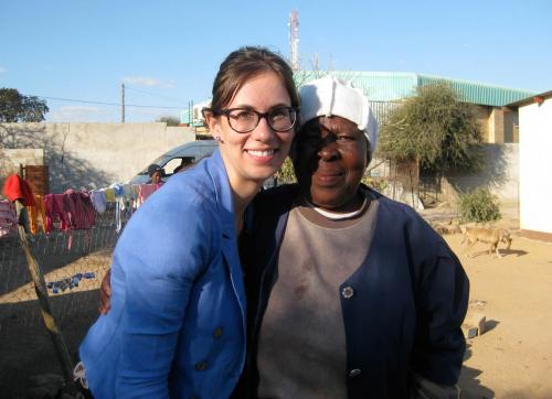 Stephanie in blue jacket hugs woman in white toque and blue jacket