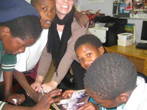 Kids cram into a chaotic photo