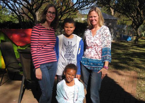 Stephanie, Alexander, Lisa and Abigail pose together outside.