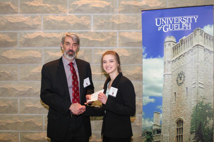 Mara McHaffie and John Fryxell shaking hands