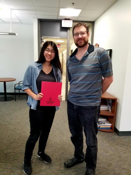 Photo of Hagen Award recipient Elisa Lau and the Chair of Integrative Biology, Ryan Gregory