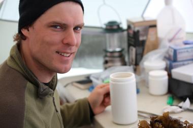 Picture of Rob Young beside a field work bench