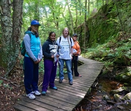 Dr. Leslie Rye and students taking part in research while on a field course.