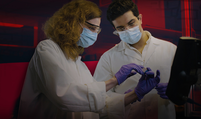 Abdullah and Karen working in a lab