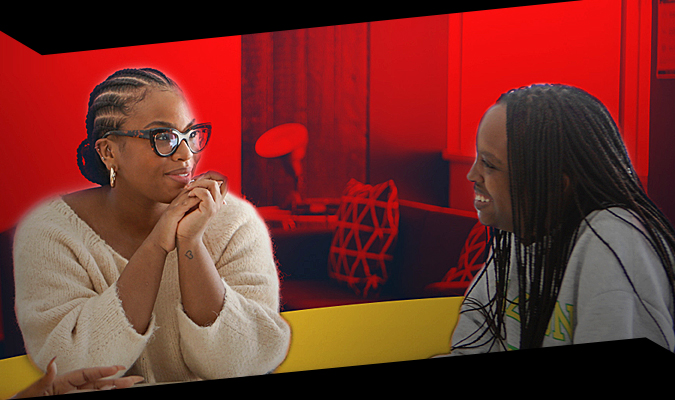 Two female students sitting and chatting