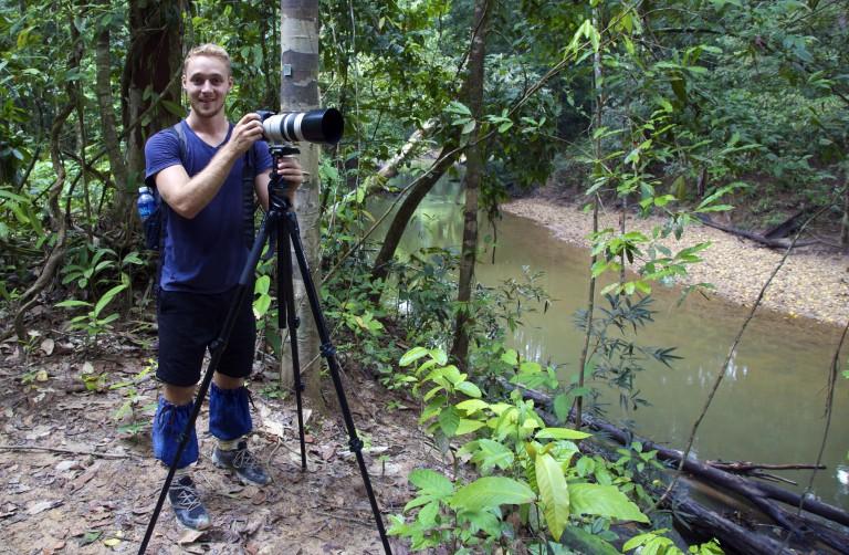 David Borish with camera in jungle