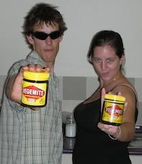 Two students holding jars of Vegemite